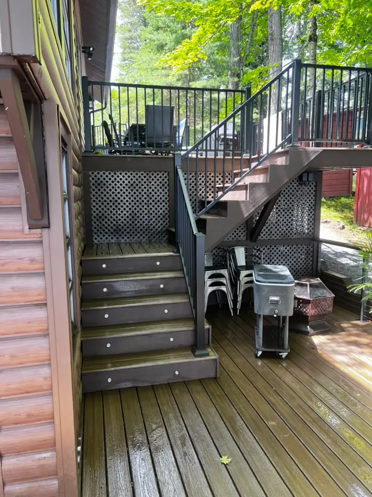Deck stairs, railing and lattice skirting cleaned by power washing