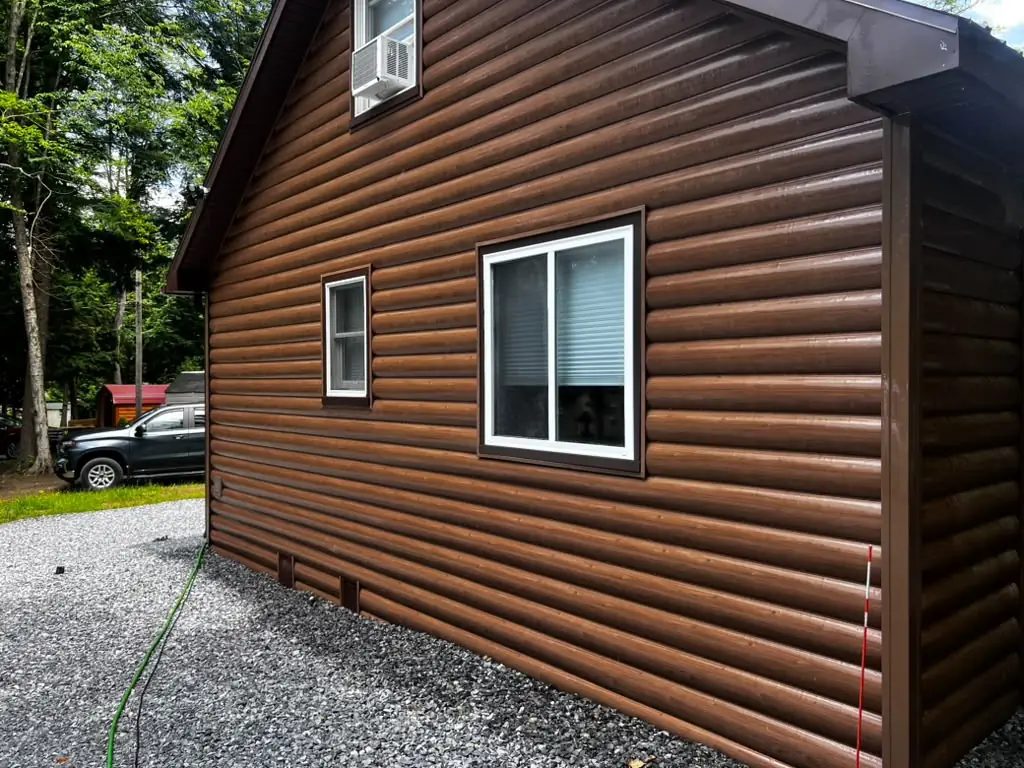 Log cabin siding and windows freshly power washed